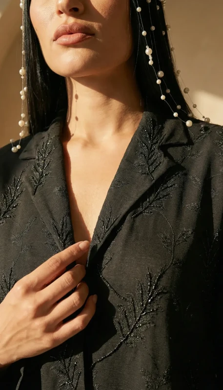 Subtle tonal embroidery on black kimono abaya collar - refined modest luxury