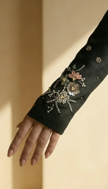 Hand embroidered floral sleeve detail on Elara black kimono